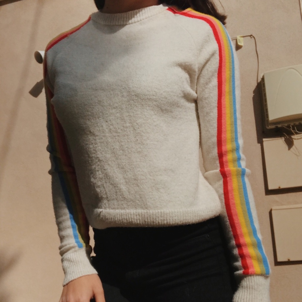 Sweater with rainbow stripes on arms